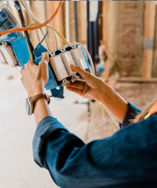 A person is working on a machine in a factory