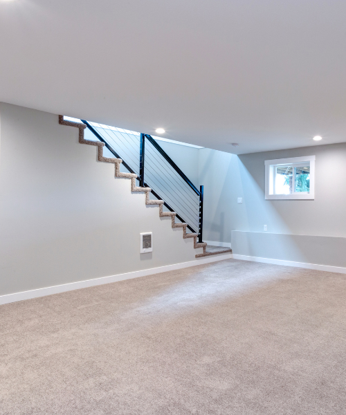 An empty room with a stair case in it